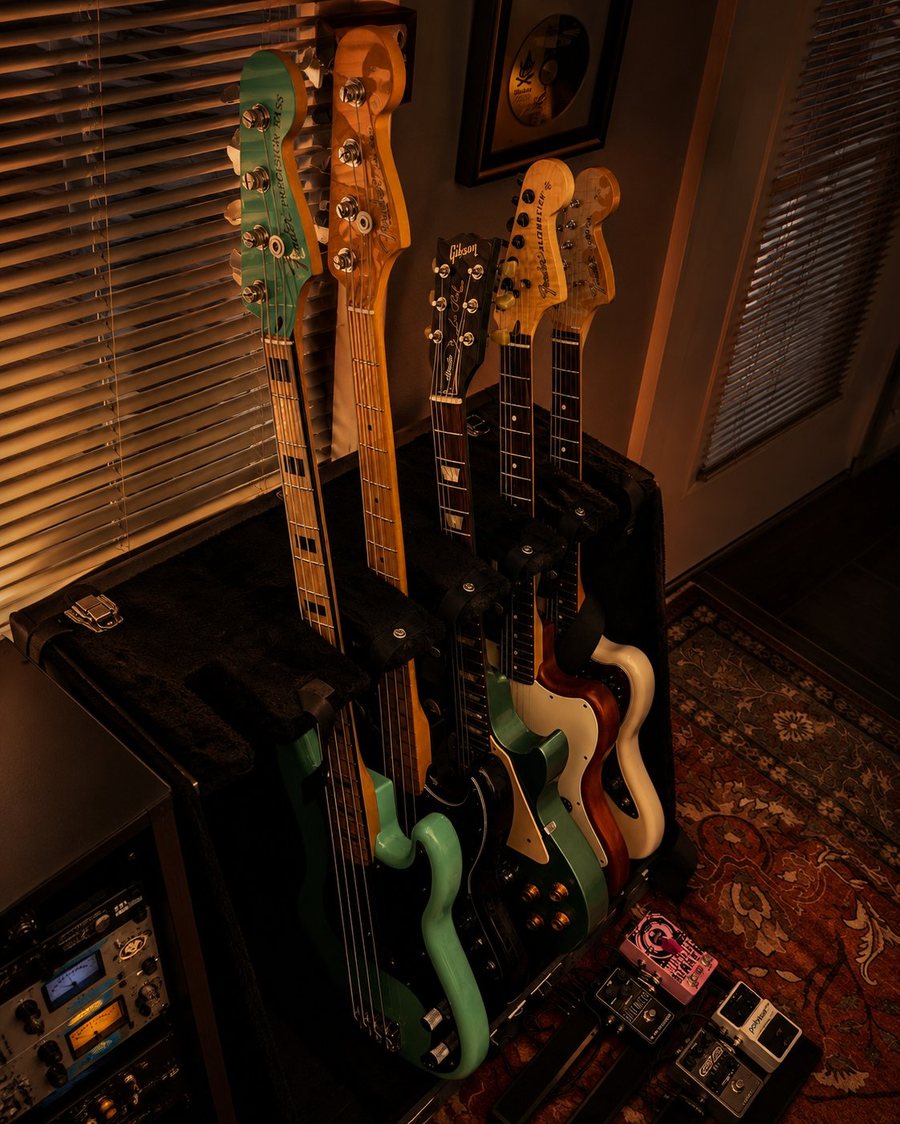 Guitars and basses lined up at Bad Art Records